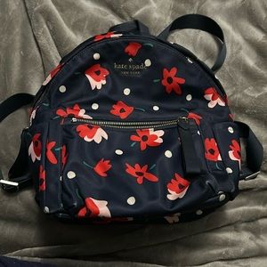 Kate spade backpack. Navy with red and pink floral print.